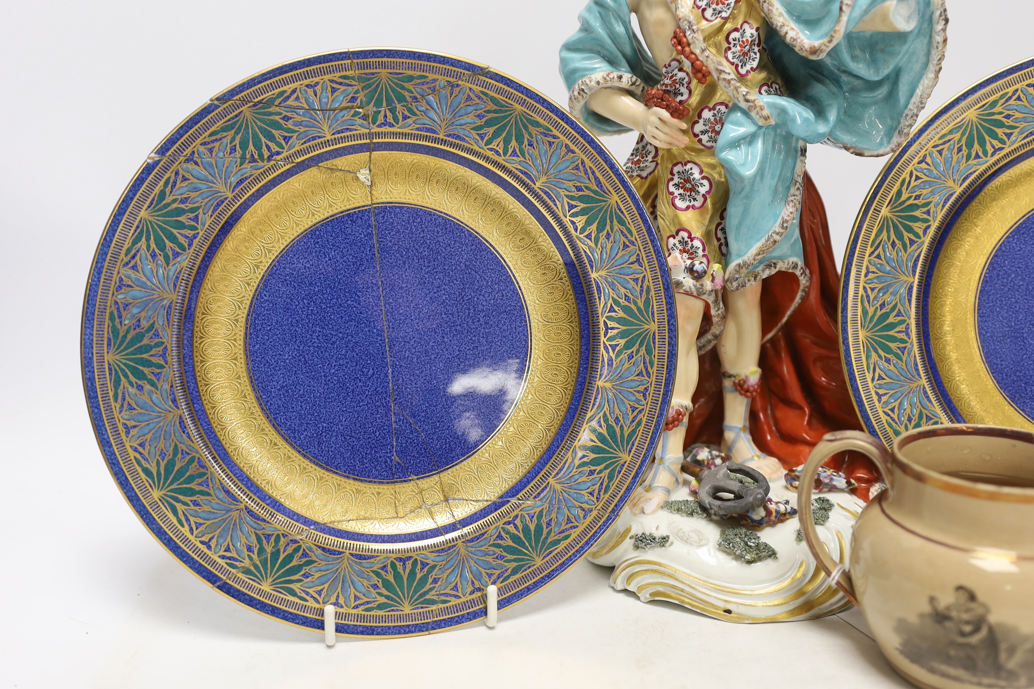 A Derby style figure of Neptune, two Wedgwood plates (one a.f.) and a Staffordshire drab ground jug, largest 32cm high